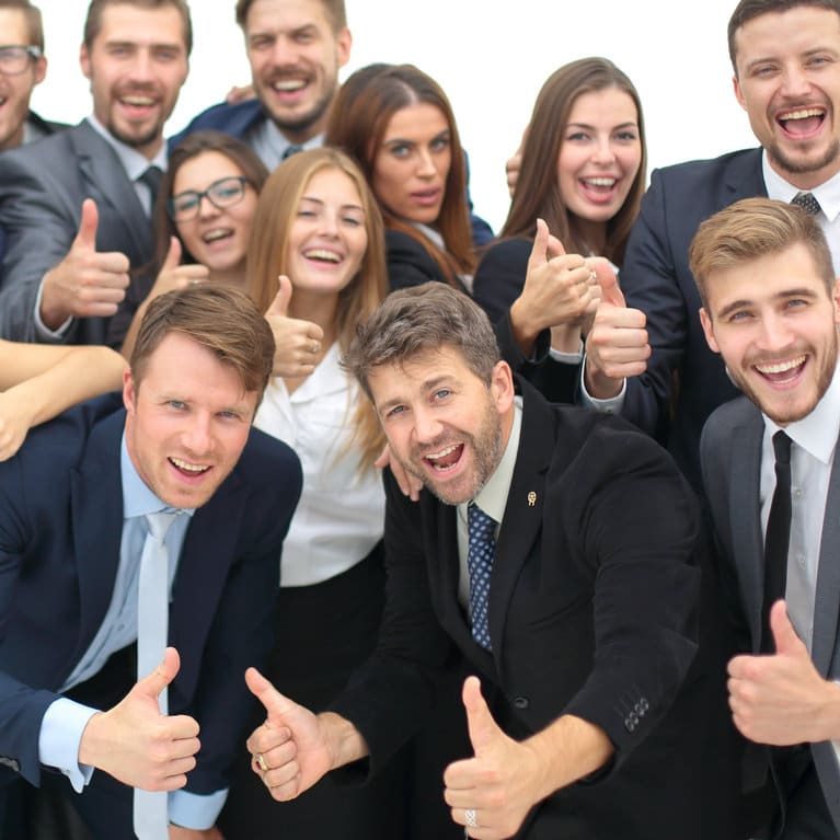 Portrait of smiling happy business people against white background celebrating